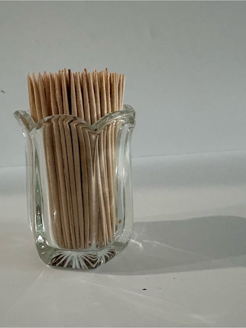 Vintage clear pressed glass toothpick holder w/ a paneled body & scalloped rim